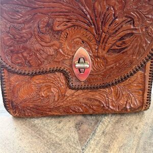 Hand-Tooled Brown Leather Crossbody Bag with Turn-Lock Closure